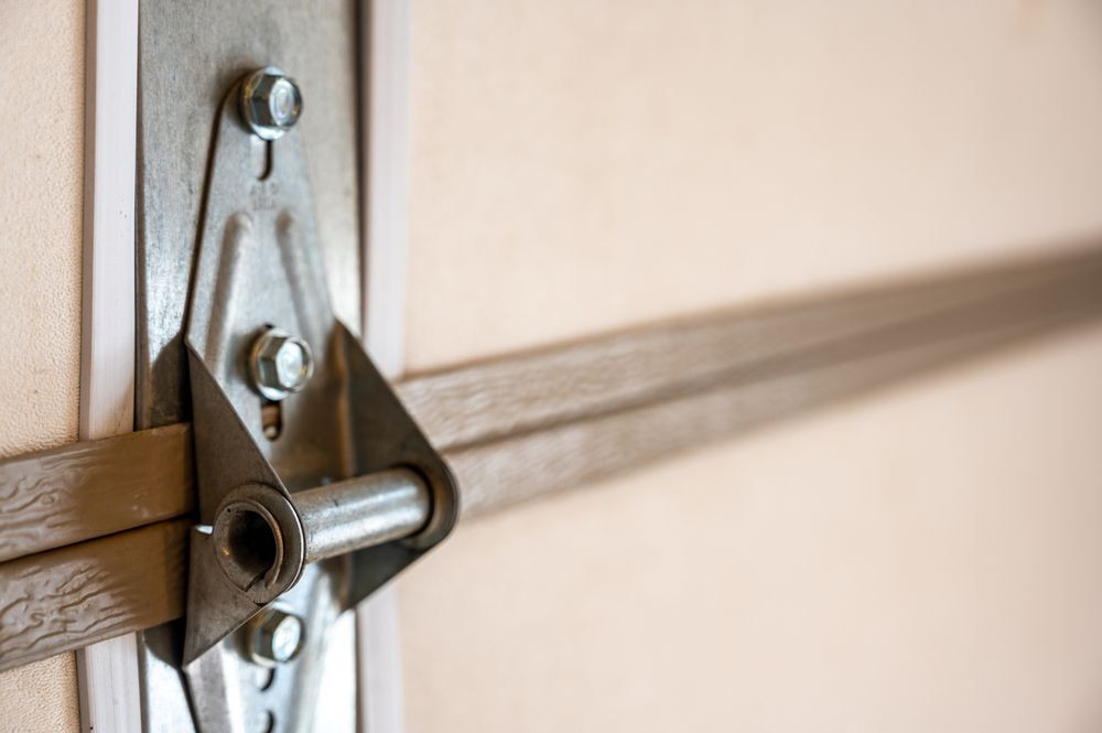 Close-up of a garage door hinge and mounting hardware